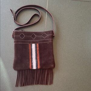 Chocolate brown crossbody purse.  Zipper closure.